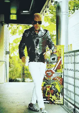 Leather jacket, white pants, art panel